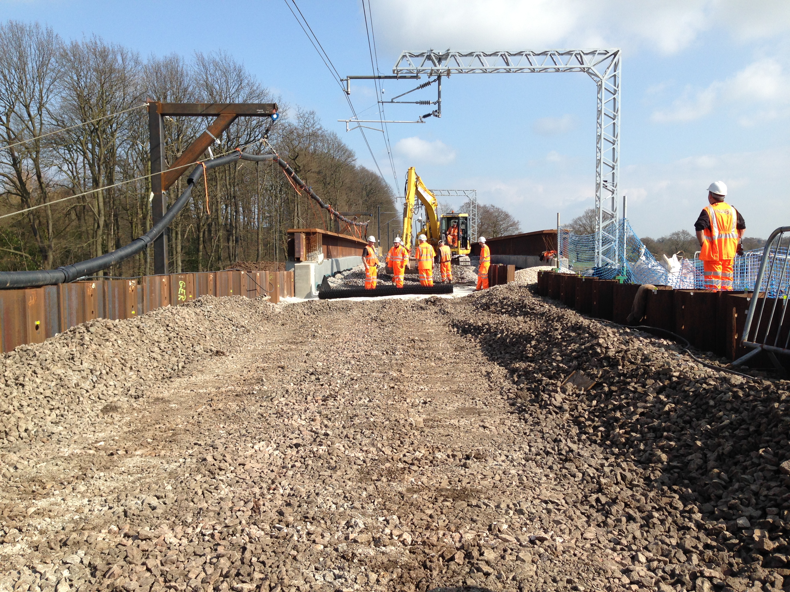 Site workers roll out Tensar geogird on railway track